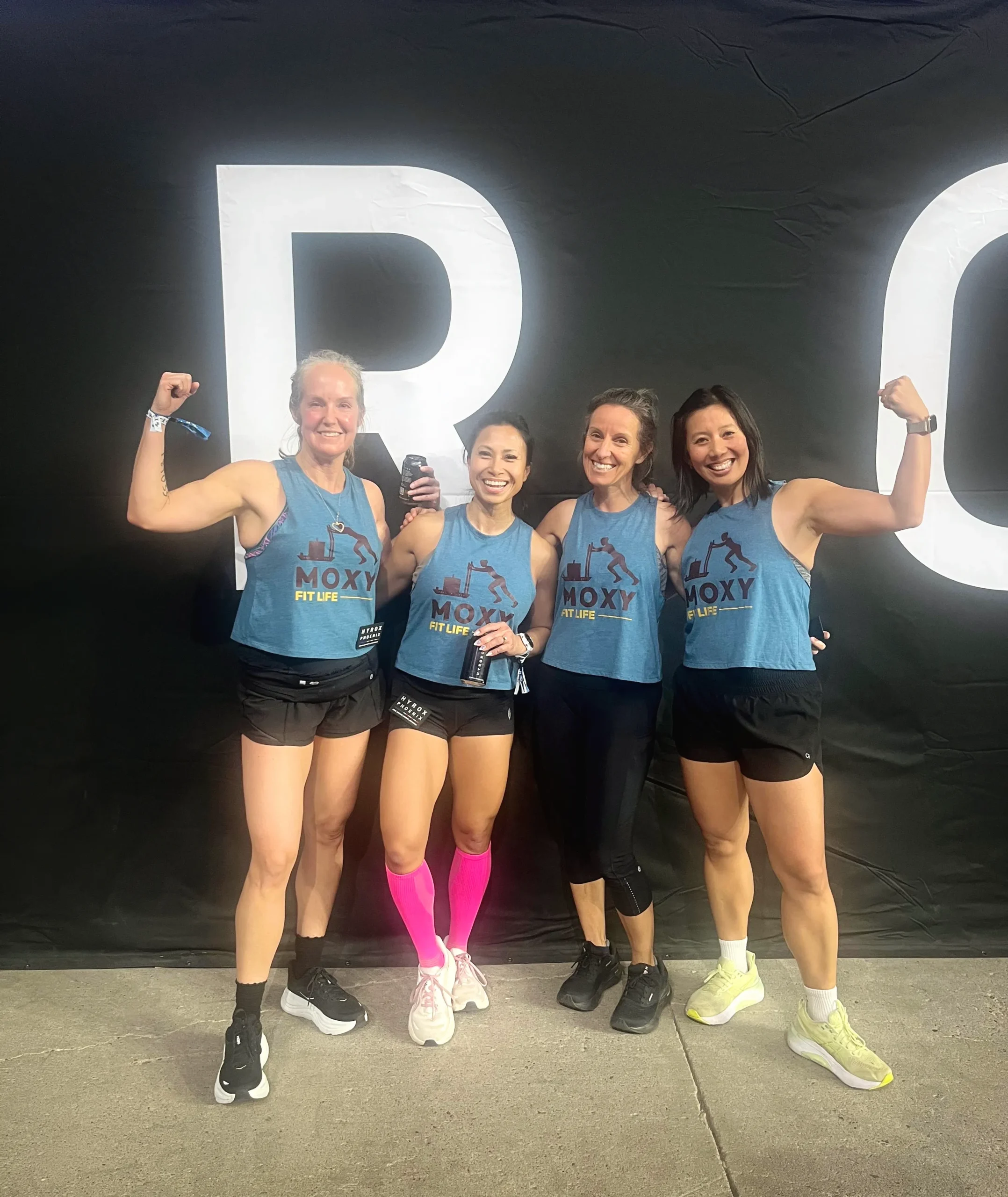 Four Moxy Fit athletes celebrating together after a HYROX event